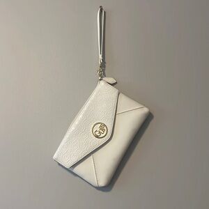 white guess leather clutch